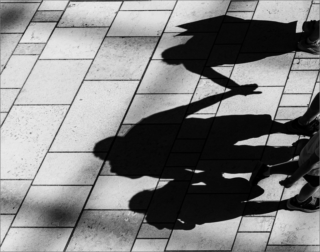 shadows of people in cabot circus bristol